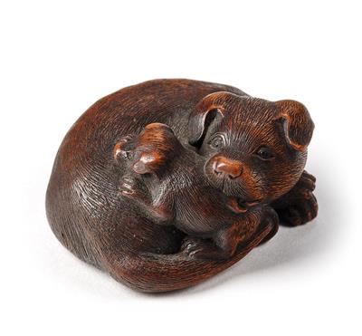 A wood netsuke of a lying dog with a puppy, Japan, early 19th century, signed - Mobili