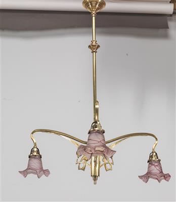 A late Art Nouveau brass chandelier, - Nábytek