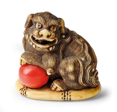 A Netsuke of a Shishi with Ball, Japan, 19th Century, - Works of Art - Part 1