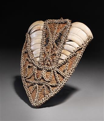An early split boar tusks armor decorated with fibre, nassa shells  &  poisonous abrus precatorious seeds. - Tribal Art