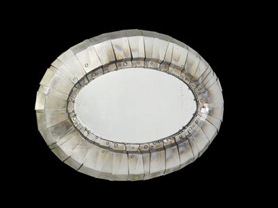 A large oval wall mirror, - Design